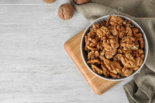 Preview: Flat lay composition with walnuts and space for text on wooden background