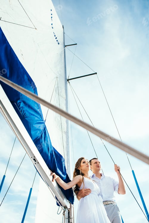 Preview: young couple guy and girl on a sailing yacht