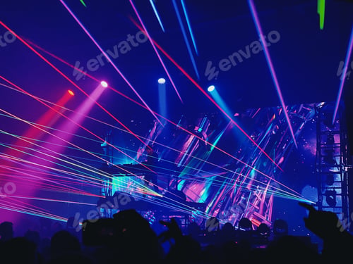 Preview: Silhouettes of crowd against neon lights at a concert