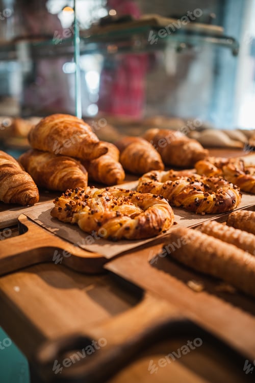 Preview: Shot of some delicious pretzels surrounded by other pastries on display in a cafe showcase