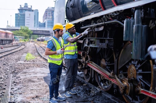Preview: Engineer railway wearing safety gear checking train transmittal system for safety travel passenger