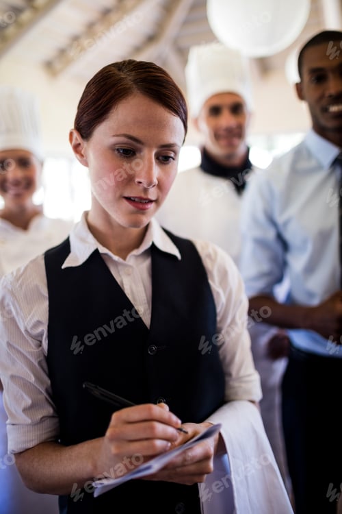 Preview: Group of hotel staffs standing in hotel