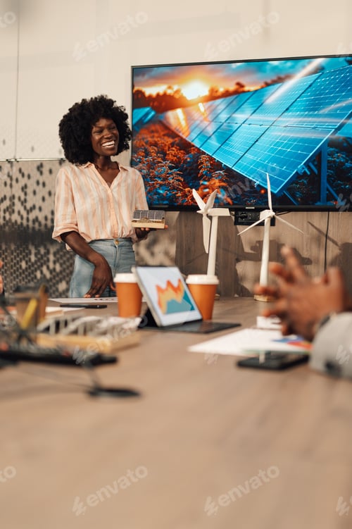 Preview: Interracial smiling expert with solar panel talking about renewable energy