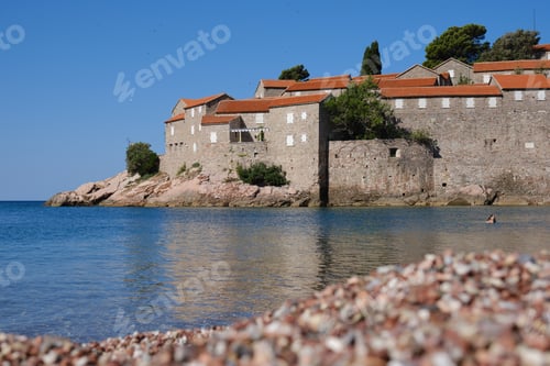 Preview: Beautiful empty beach near Sveti Stefan island at sunny summer day in Montenegro.