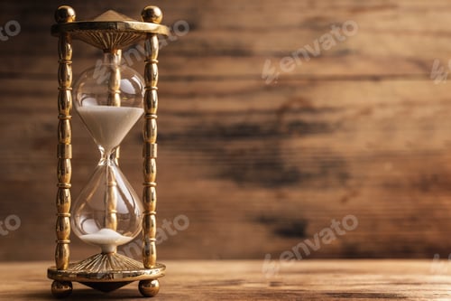 Preview: Hourglass on the wooden table with a wooden background
