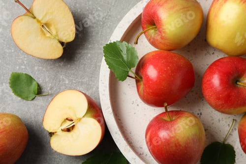 Preview: Red apples on grey background, top view