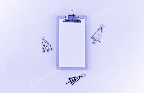 Preview: Mockup blank on clipboard and wooden painted funny Christmas trees on white