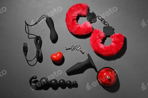 Preview: Different sex toys on dark background, flat lay