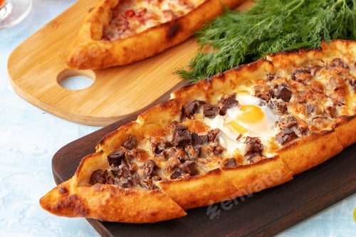 Preview: Close up of Turkish Pide bread on wooden table