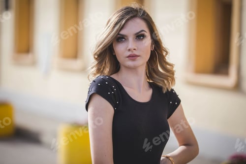 Preview: Shallow focus shot of an attractive blonde hair Caucasian female looking around