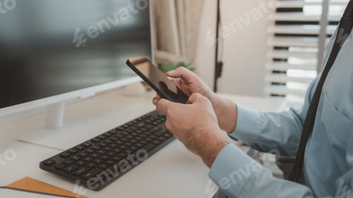 Preview: an entrepreneur is working diligently in an office, a businessman is using a smartphone