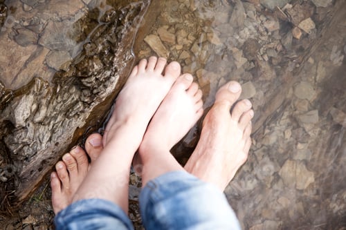 Preview: Close-up of father with daughter standing in water of a lake