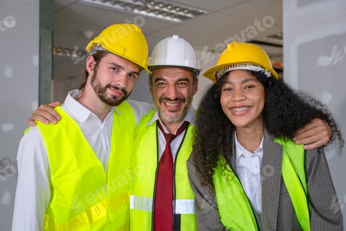 Preview: Engineers work in high rise building.