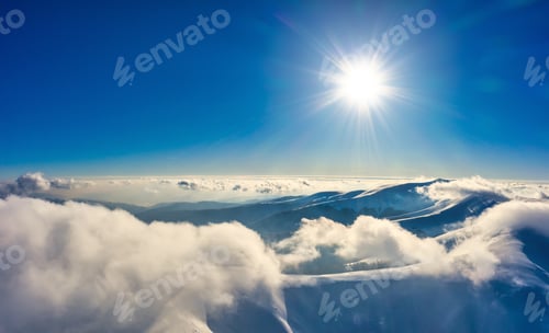 Preview: Flight through evening sky with clouds over mountain