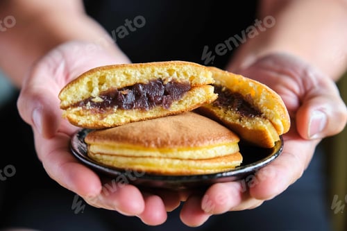 Preview: Person offering japanese dorayaki.