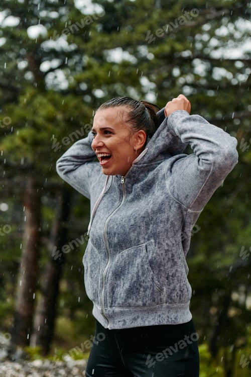 Preview: Beautiful Woman Enjoying Rainy Day After Intense Run