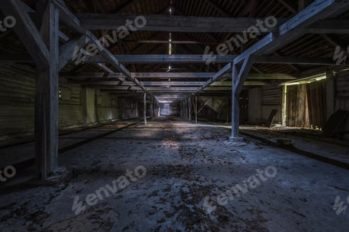 Preview: inside dark abandoned ruined wooden decaying hangar with rotting columns