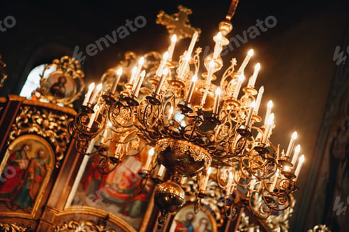 Ornate Golden Chandelier Inside a Dark Church