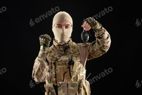 Preview: front view young soldier in uniform with grenade on black background warrior tank israel