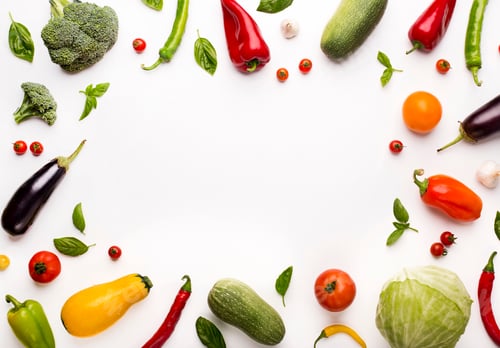 Preview: Frame of colored organic vegetables on white