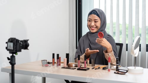 Preview: Woman muslim blogger is showing present make up tutorial beauty cosmetic review product