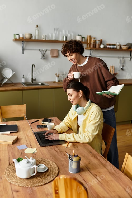 Preview: Couple enjoying each others company while working together at home in a cozy kitchen setting