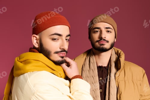 Preview: Stylish twin brothers showcase modern fashion in vibrant colors during a photoshoot