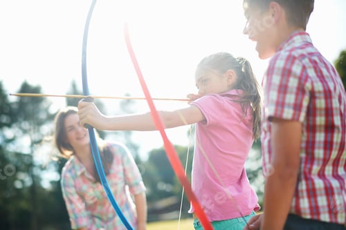 Preview: Girl learning archery from teenage sister and brother