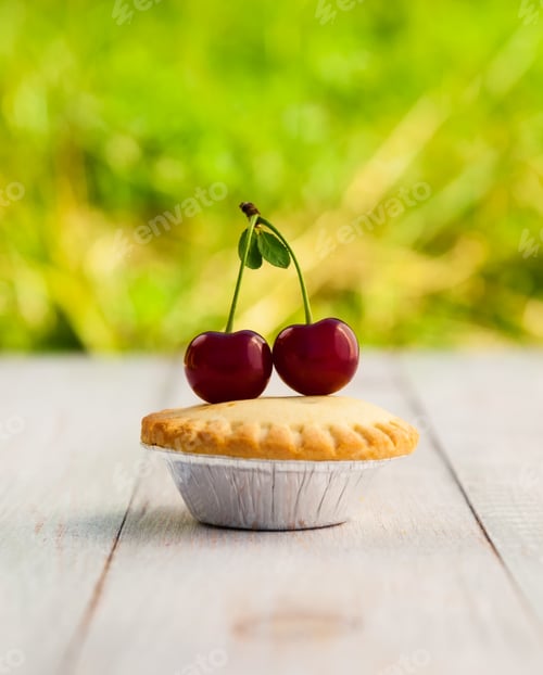 Tart with Cherries on Wooden Table Outdoors