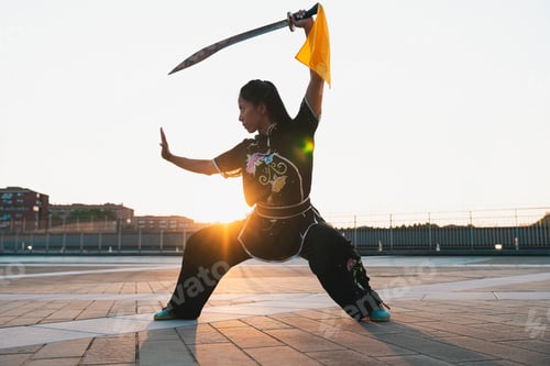 Preview: Chinese young woman practicing wushu kung fu.