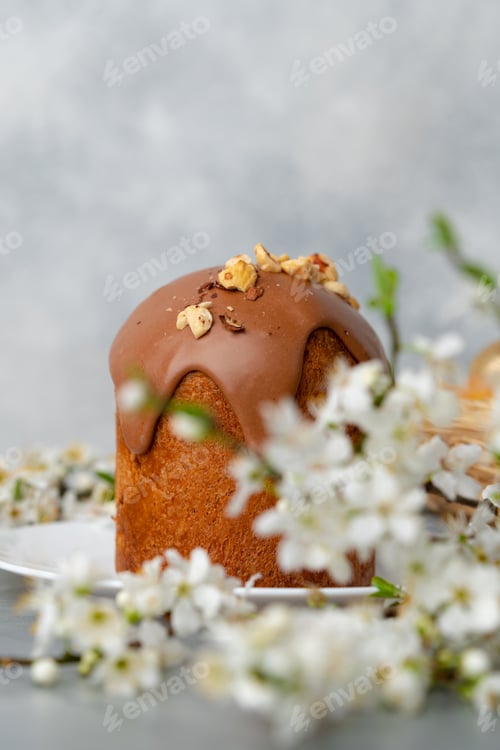 Preview: Ester cake with chocolate topping and nuts on gray background