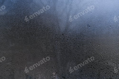 Preview: wet glass background. water drops on the window