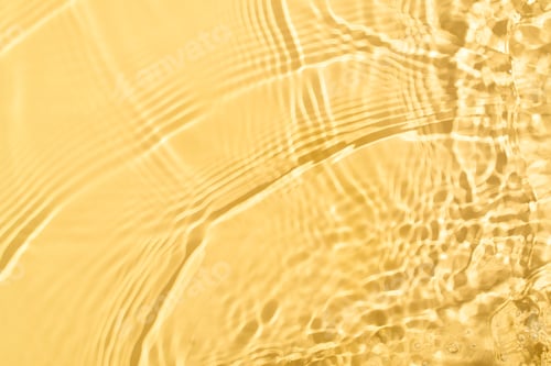 Preview: Transparent and clean yellow water background with sunlight reflection