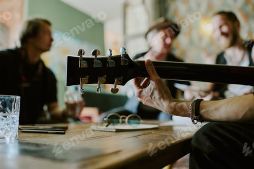 Preview: Unrecognizable Man Playing Guitar At Party With Friends