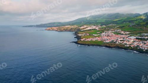 Preview: Morning seaside village landscape aerial shot. Drone flying beautiful coastline