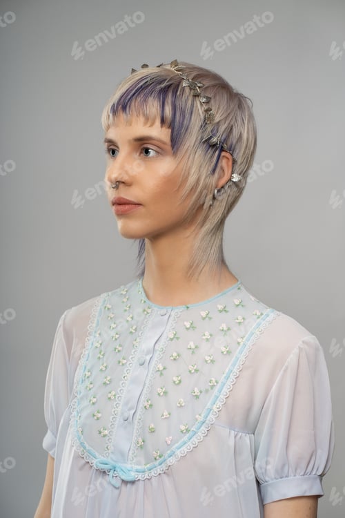 Preview: Side Profile Portrait of Woman with Septum Piercing and Floral Top - Modern and Stylish