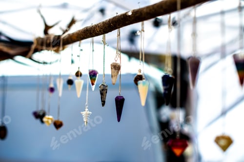 Preview: Colorful crystal pendants hanging at an outdoor market
