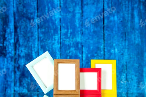 Preview: front view picture frames with colored corners on blue background present picture souvenir photo
