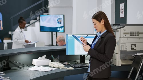 Preview: Medical worker analyzing checkup forms and report papers