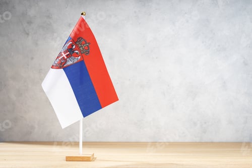 Preview: Serbia table flag on white textured wall