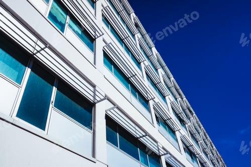 Preview: Facade of a generic building with simple diagonal lines.