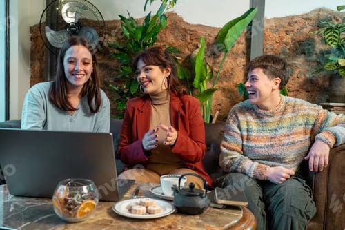 Preview: Women working together at cafe table