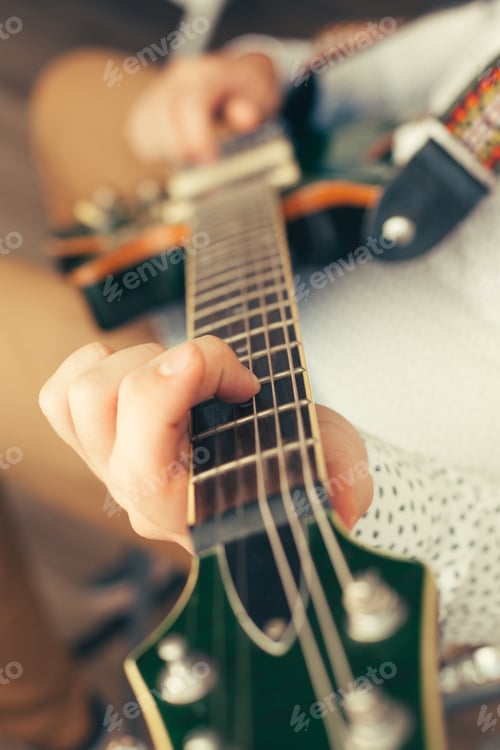 Preview: man playing electric guitar