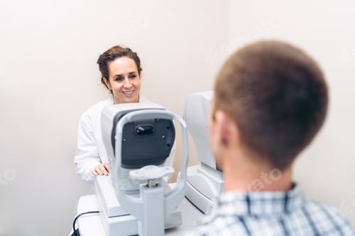 Preview: Optometrist Conducting a Visual Acuity Test on Male Patient