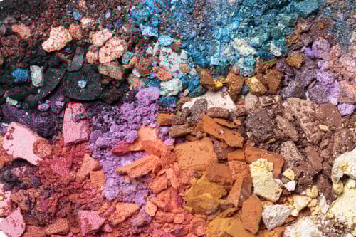 Preview: Colorful crushed powders arranged in sections showcasing various textures and hues