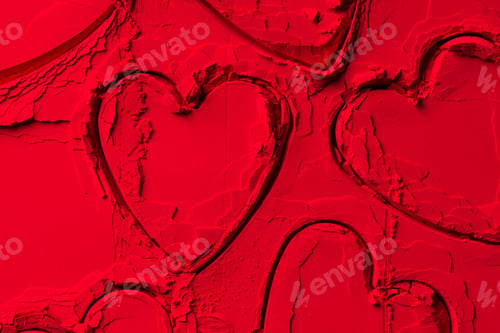 Preview: elevated view of shapes of cookie cutters in shape of hearts on red powder