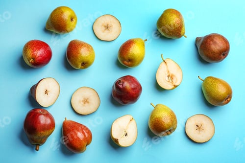 Preview: Ripe juicy pears on blue background, flat lay
