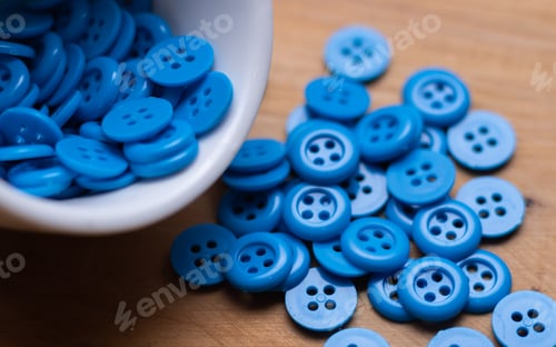 Preview: Blue button on wooden table