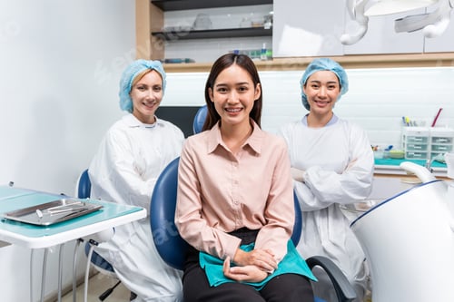 Preview: Portrait of Asian young woman patient and dentist at health care clinic.