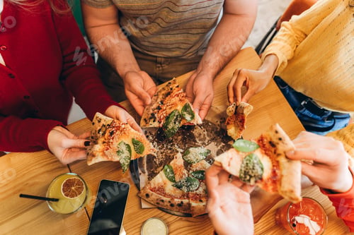 Preview: Friends sharing pizza: enjoying a delicious meal together